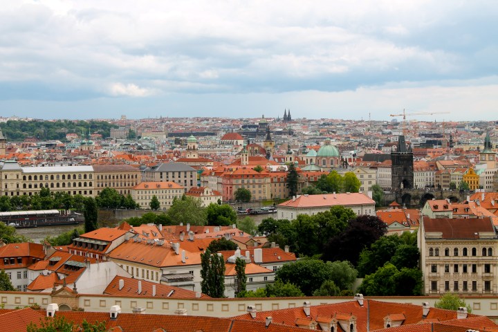 The dark tower on the right is the far end of St. Charles Bridge!
